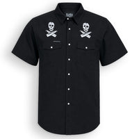 A black short-sleeve button-up shirt with two white skull and crossbones patches on the chest, displayed on a clean white background.